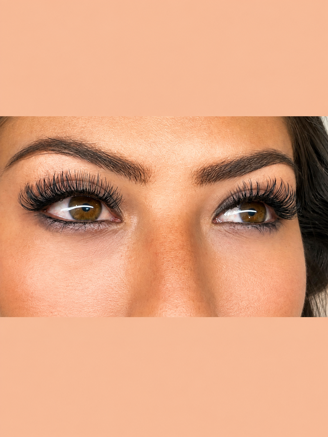 Hybrid lash extension set with textured fullness on brown eyes